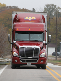 Cherry red truck driving